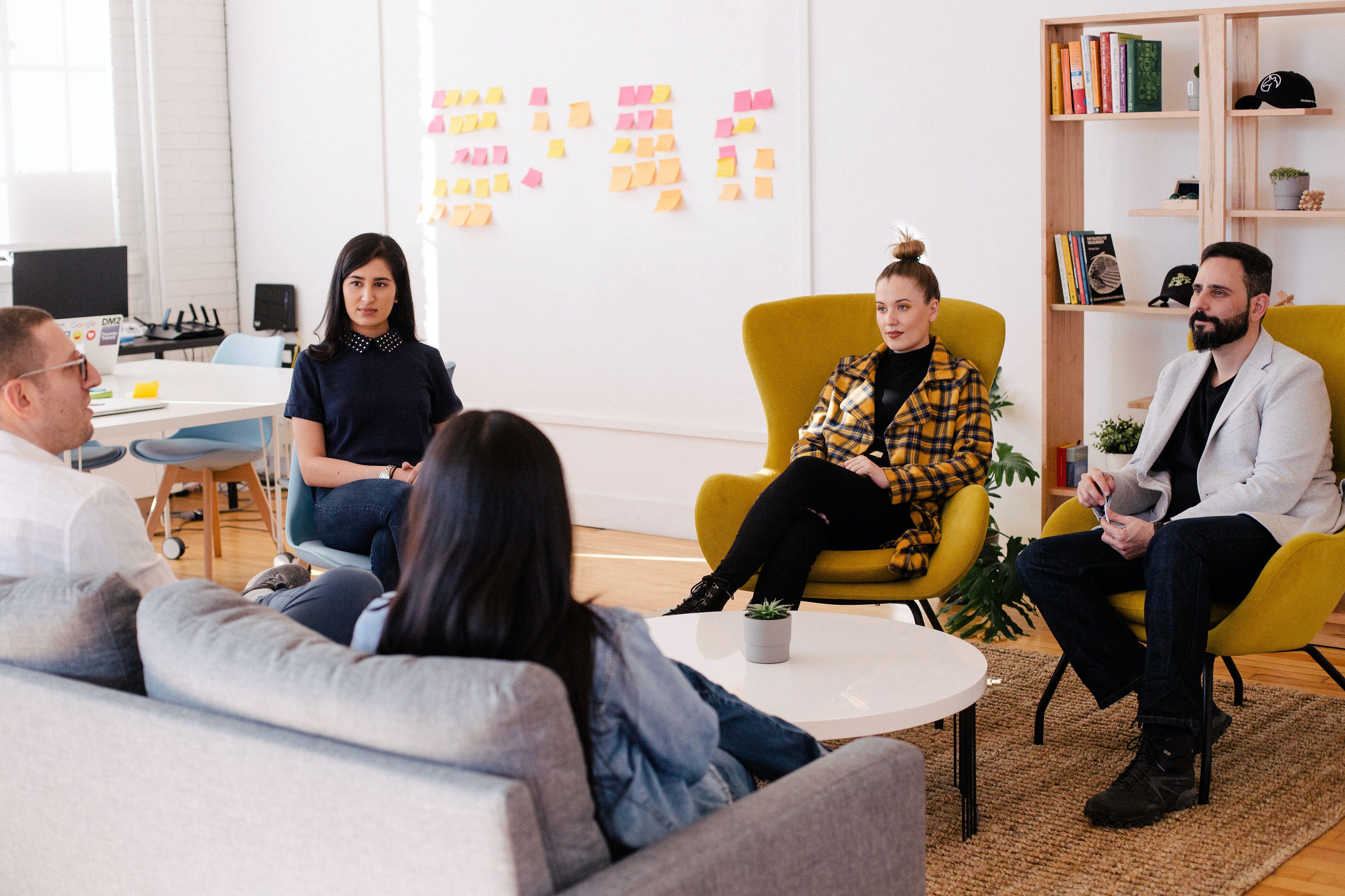 People working sitting on a couch