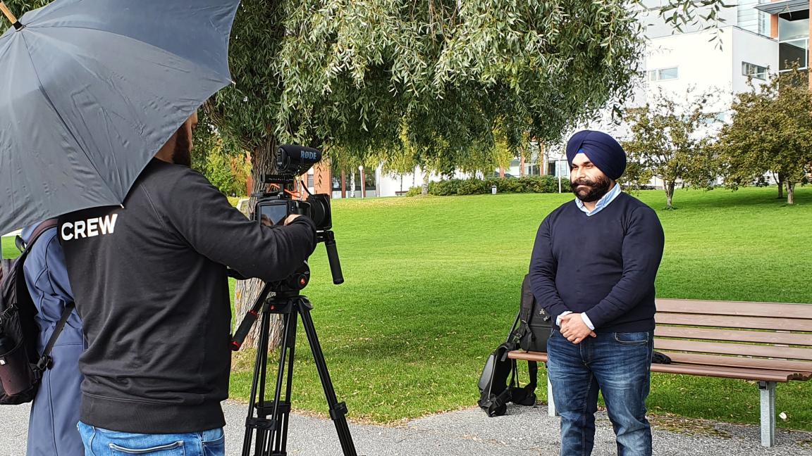 Manmeet and crew at a video shoot in the campus park