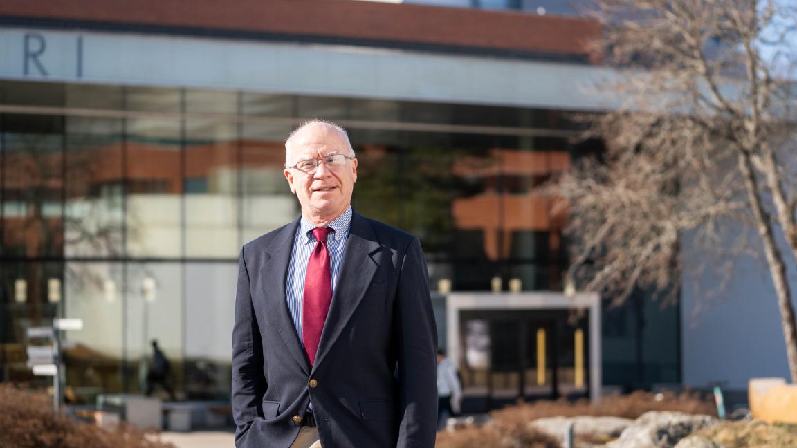 Stewart Miller posing in front of Ankkuri building