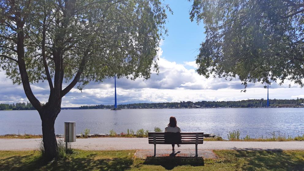 Adriana enjoying sunny summer weather and looking at the sea from the campus park