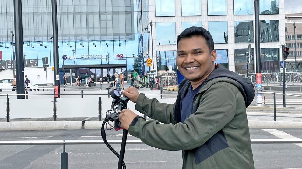 Zakir Hossan on an e-scooter in Helsinki city