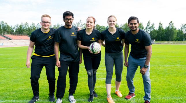 Students playing football.