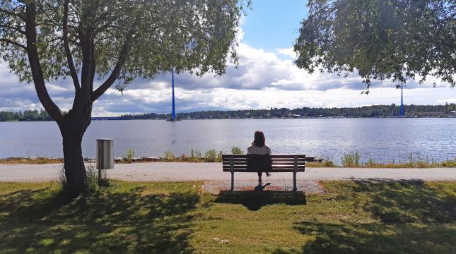 Adriana enjoying sunny summer weather and looking at the sea from the campus park
