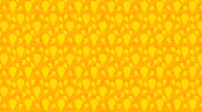 Keltaisia hehkulamppuja oranssilla pohjalla