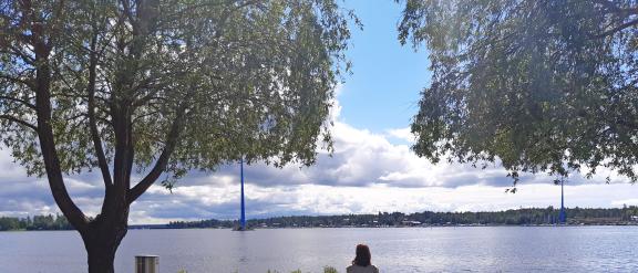 Adriana enjoying the sunny summer weather and looking at the sea from the campus park