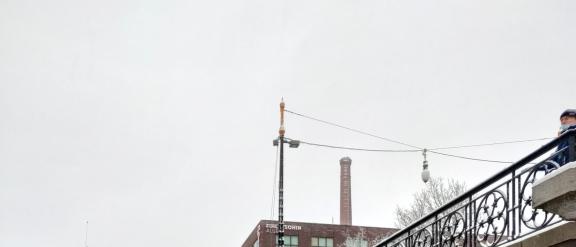 Manmeet posing in the snow in front of old Tampere