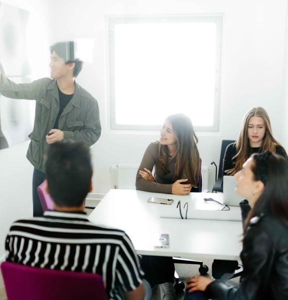 Group of students in a small meeting room