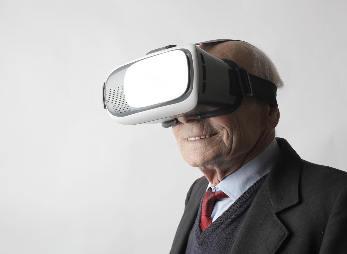Elderly person with VR glasses