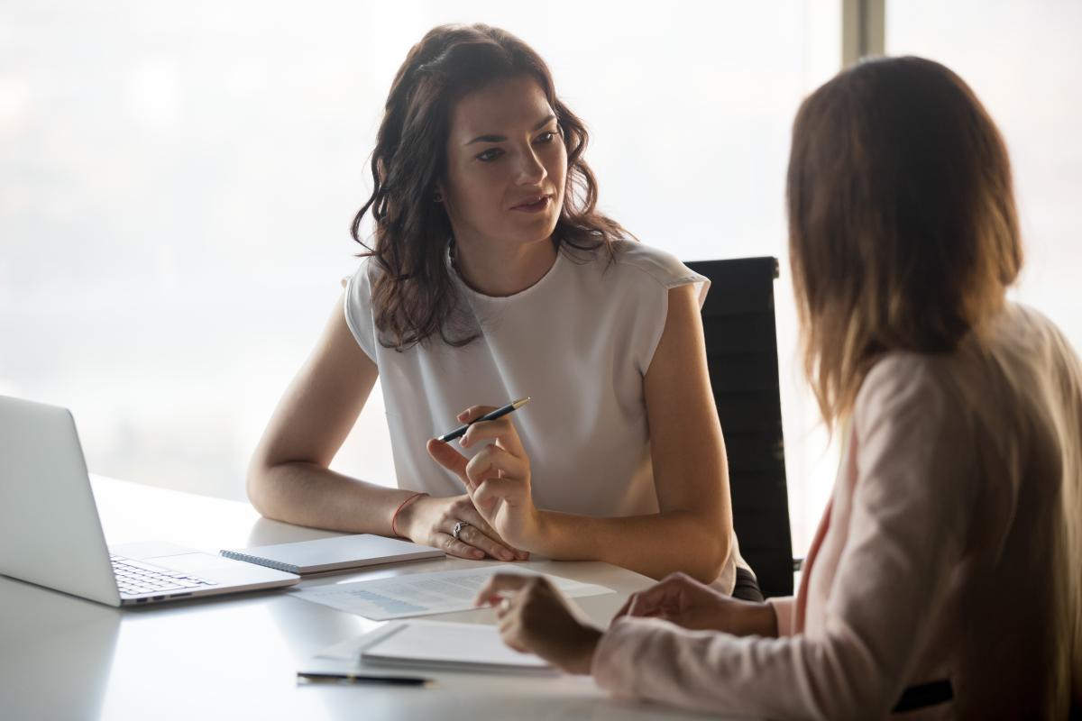 Two women discussing