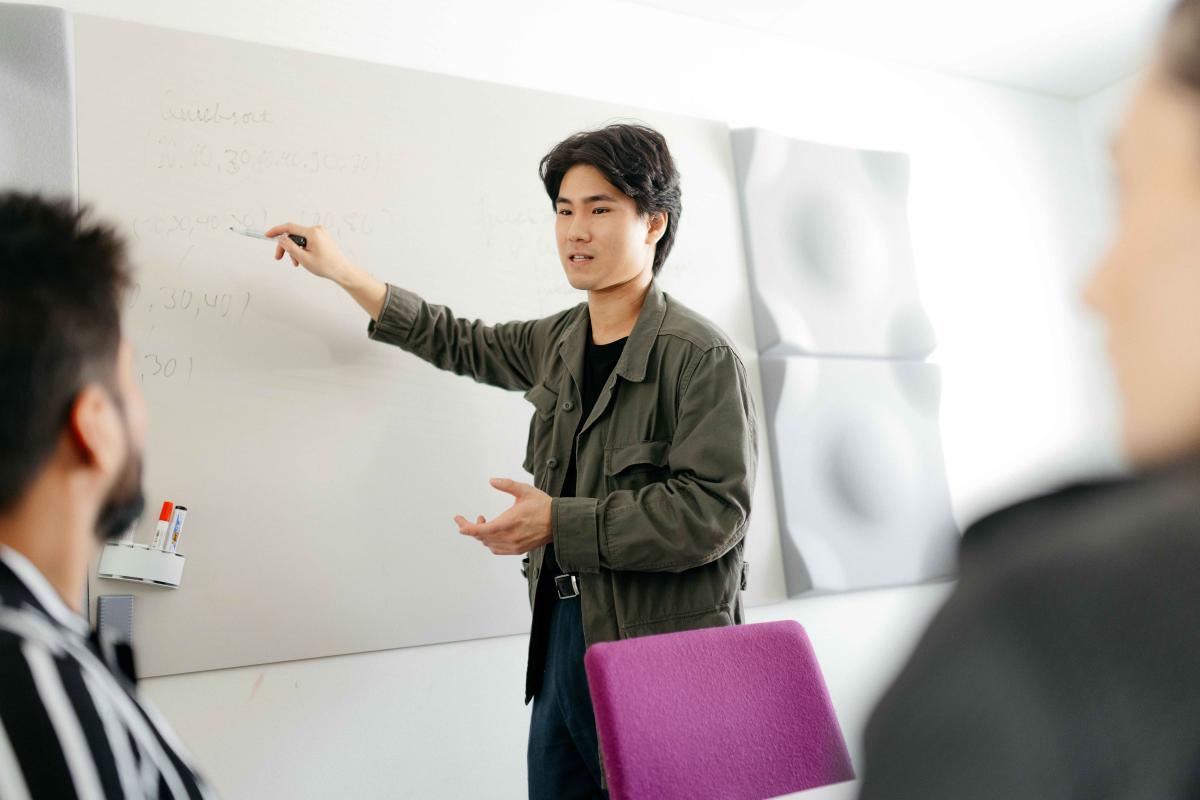 students working on white board