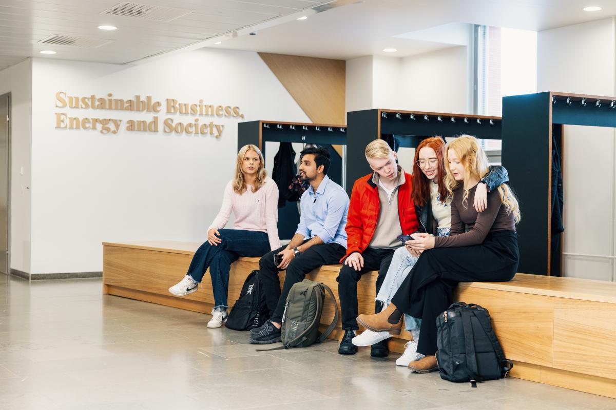 Students are sitting together in the main lobby