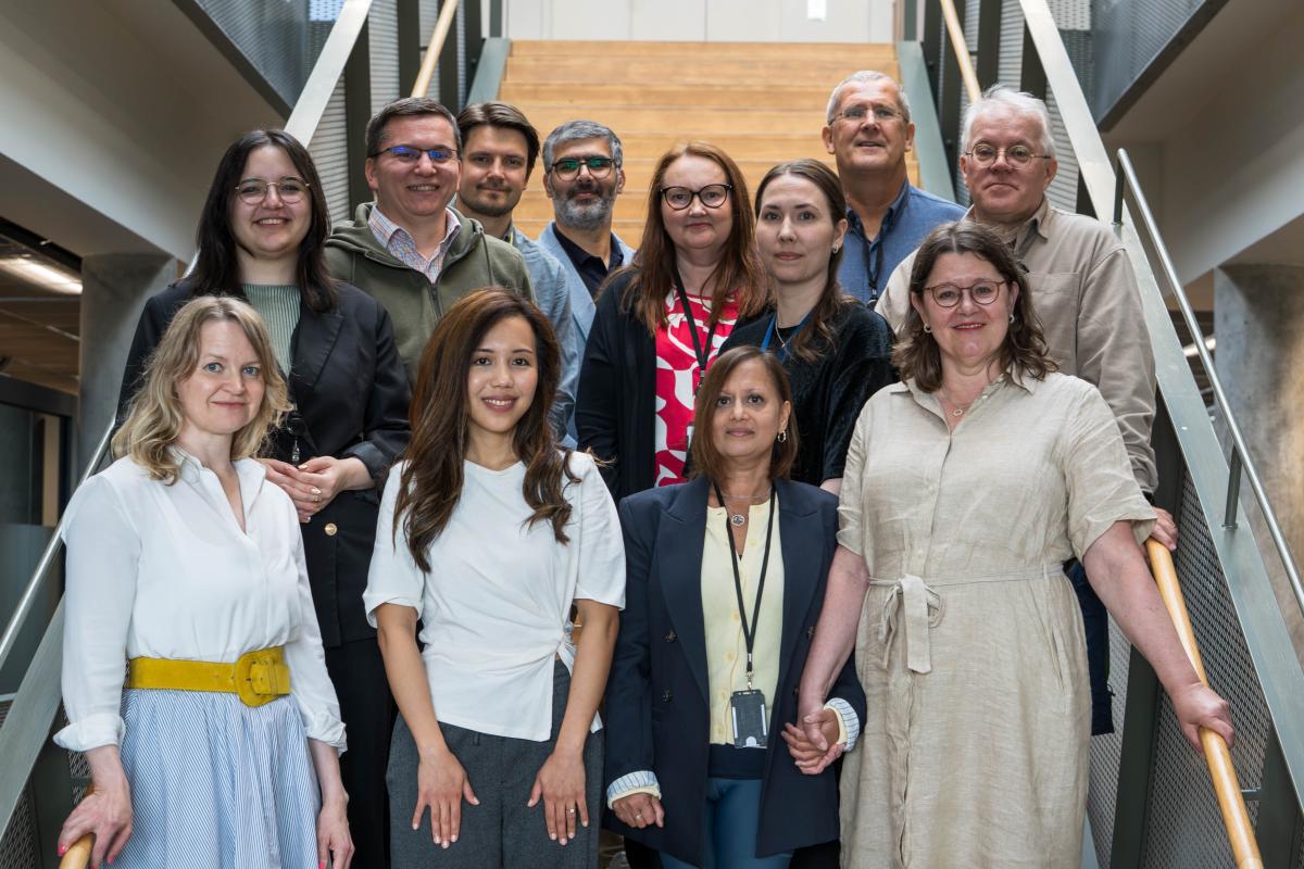 Public management research group together at Ankkuri staircase