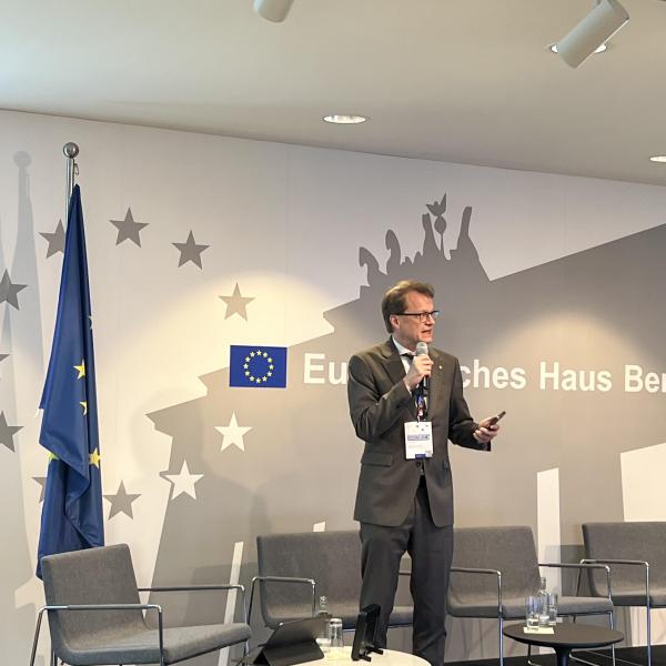Mika Grundström speaking at the event in Berlin