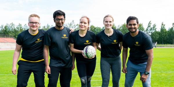 Students playing football.