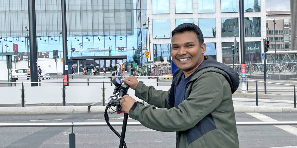 Zakir Hossan on an e-scooter in Helsinki city