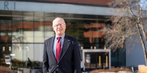Stewart Miller posing in front of Ankkuri building