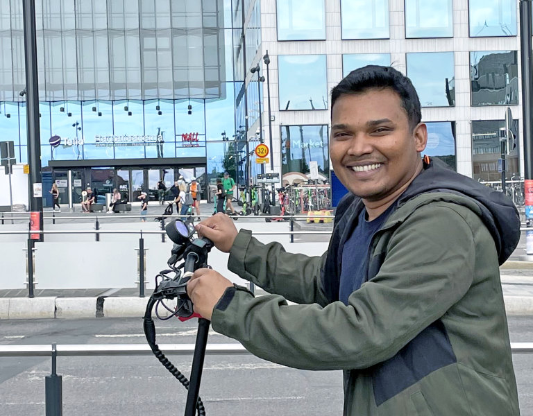Zakir Hossan on an e-scooter in Helsinki city