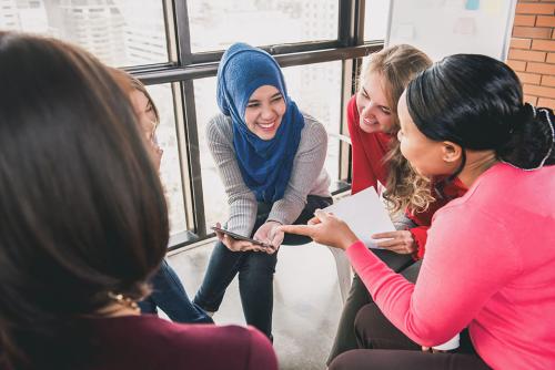 Five women discussing